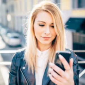 Young woman looking at phone